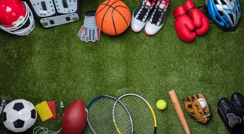 overhead shot of multi sport equipment on synthetic grass